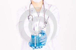 The female doctor in uniform holding hygienic gel.