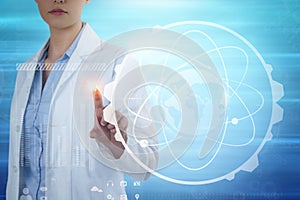 Composite image of female doctor using digital screen