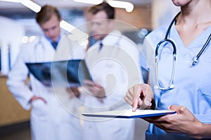 Female doctor using digital tablet