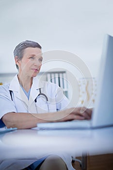 Female doctor using her laptop computer