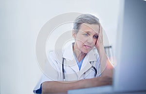 Female doctor using her laptop computer