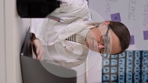 Female doctor using her laptop computer with drinking coffee on working table. Copy space.