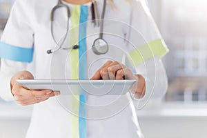 Female doctor using ipad at work in hospital