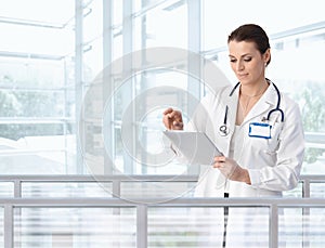 Female doctor using tablet in hospital