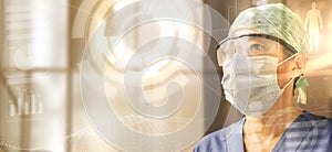 Female doctor wearing cap, glasses and protective mask looking at a transparent digital screen, concept of the future of medicine