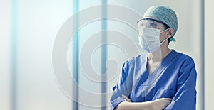 Female doctor wearing surgical mask, concept of hospital and health care professionals