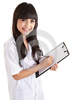 Female doctor writing on binder clip