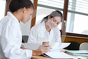 Female doctors at library