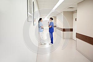 Female doctors or nurses talking at hospital