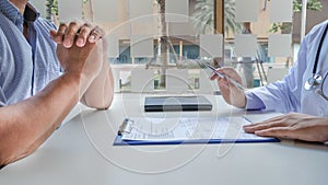 Female doctors who treat patients make an appointment to listen to the results after a physical examination and explain medical