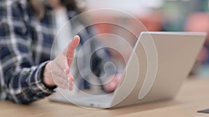 Female doing Hand Shake Gesture while using Laptop, Close up