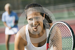 Female doubles tennis players waiting for serve focus on foreground close up