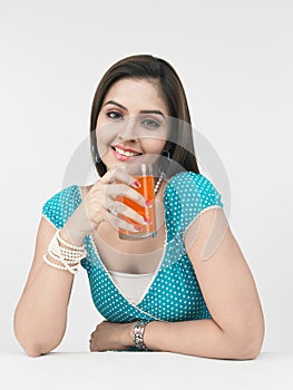Female drinking orange juice