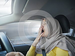 Female Driver Asleep While Driving a Car