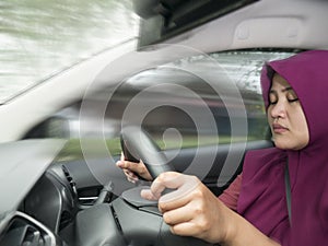 Female Driver Asleep While Driving a Car