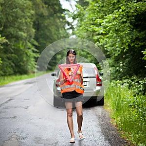 Female driver after her car has broken down