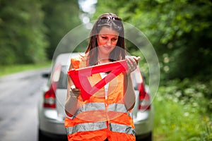 Female driver after her car has broken down