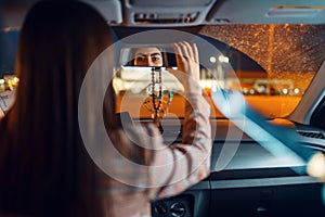 Female driver at the night, car burglar risk