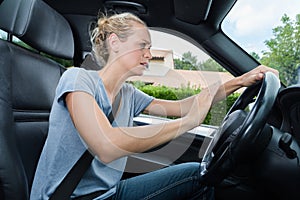 Female driver sounding horn car photo