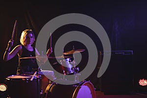 Female drummer performing in nightclub