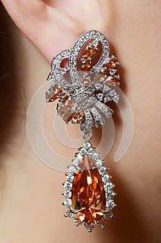 Female ear in jewelry earrings