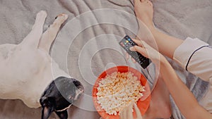 Female eating popcorn watch tv show