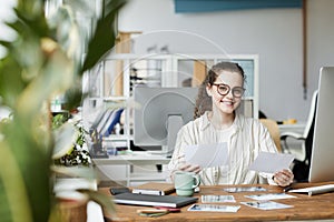 Female Editor at Desk in Publishing Office