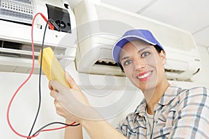 female electrician testing c