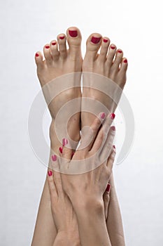 Female elegance feet red pedicure nails spa therapy