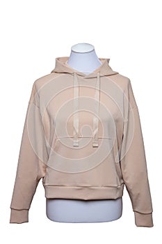 Female elegant beige hooded sweatshirt with long sleeves on mannequin for print isolated on a white background. Clipping path.