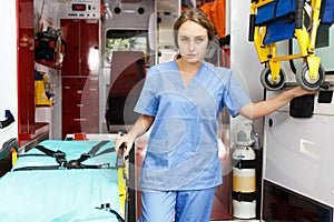 Female emergency doctor in ambulance car