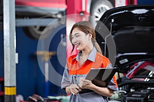 Female employee of customers in car maintenance department. Car center accountant. woman holding clipboard checking maintenance