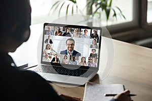 Female employee have team web conference on laptop