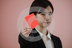 Female employee issuing a red card