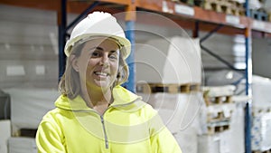 Female employee smiling and looking at camera.