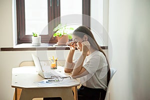 Female employee taking a minute break resting her eyes.