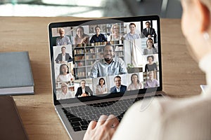 Female employee talk on video call with colleagues