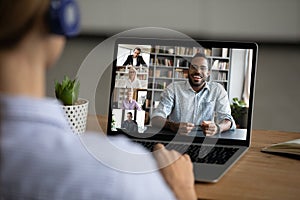 Female employee talk on video call with diverse colleagues