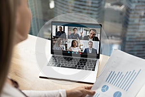 Female employee talk on video call with diverse colleagues