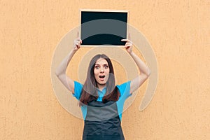 Female Employee Wearing Uniform Apron Holding Blackboard Sign