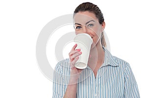 Female employer enjoying beverage