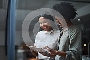 Female empowerment in the work place is vital. Two businesspeople working in a modern office.