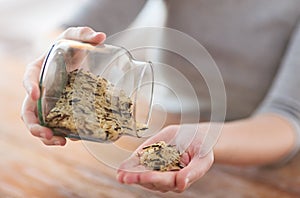 Female emptying jar with white and wild black rice