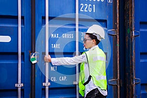 Female engineer checking containers box from cargo, Logistic concept