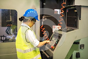 Female engineer command factory automate machine photo