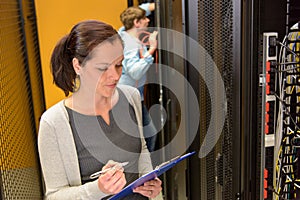 Female engineer in datacenter