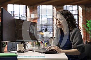 Female IT engineer doing maintenance on artificial intelligence systems