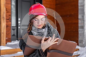 Female engineer taking notes outdoor