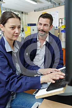 Female engineer typing on computer keyboard
