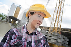 female engineer wearing helmet outdoors